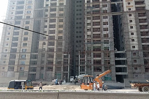 Photo essay: In Hyderabad's IT suburb, a layer of construction dust engulfs citizens