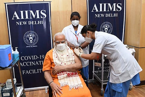 Narendra Modi receiving his second shot of the COVID-19 vaccine