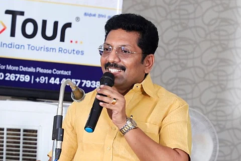 DMK MLA Dr P Saravanan addresses with a mic