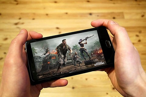 File photo of a person playing PUBG on their phone