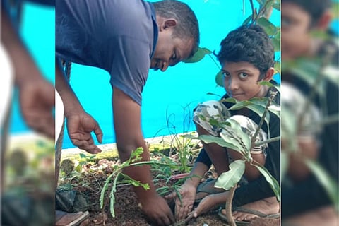 Pavan Nash planting a sapling