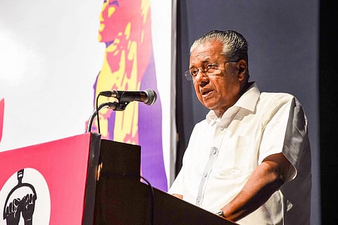 Kerala Chief Minister Pinarayi Vijayan talking into a mic