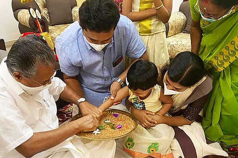 Pinarayi Vijayn initiates a child to letters