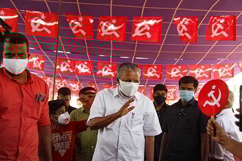 Kerala CM Pinarayi waving at supporters