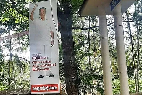 Pinarayi Vijayan is god poster outside temple