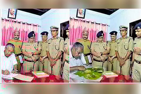 Three arrested for circulating fake photo of Kerala CM feasting at police station
