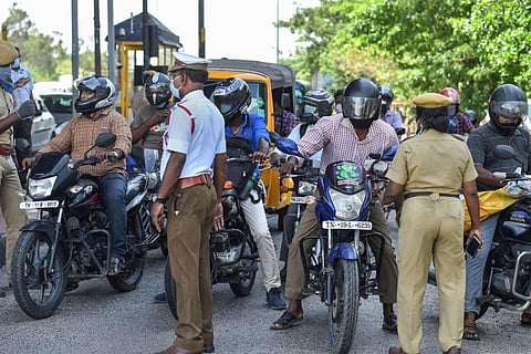 Residents being checked by police on the road