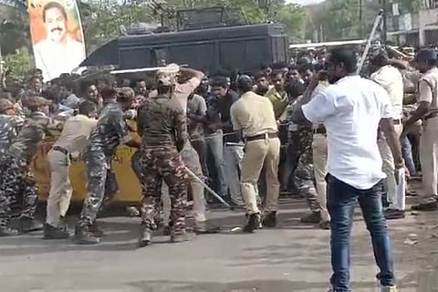 Police struggling to control the crowd from breaching barricades and reaching the district Collectorate in Amalapuram on May 26