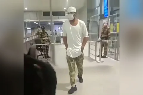 Prabhas is seen wearing a white t-shirt and camouflage pants in the photo.