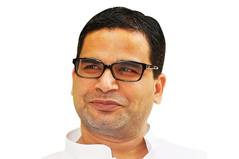 Prashant Kishor looking away from the camera and smiling
