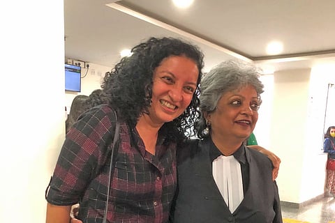 Priya Ramani and lawyer Rebecca John pose for a photograph after the verdict in the MJ Akbar defamation case.