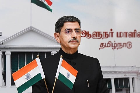 RN Ravi in Raj Bhavan wearing a black suit and specs