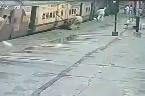 CCTV footage of woman being rescued by railway constable