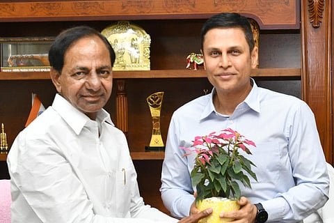 Rajat Kumar presenting CM KCR a sapling