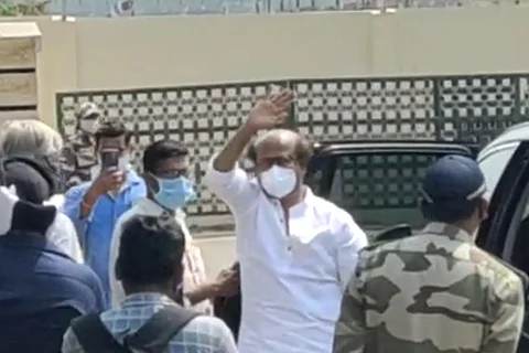 Rajini is seen waving at fans cheering for him, while leaving to Hyderabad for shoot.