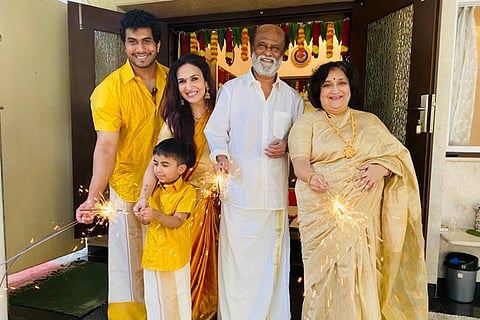 In the photo Rajinikanth and his family are seen bursting crackers