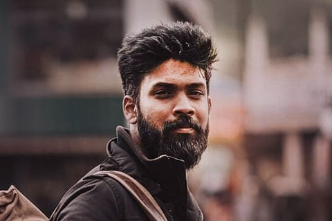 Director Rohith VS with a beard and dressed in black