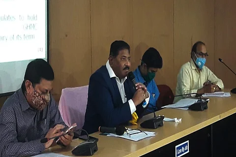 SEC officials announcing GHMC election schedule earlier in Hyderabad