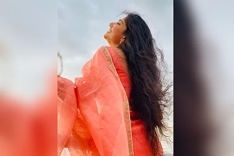 Sai Pallavi in a pastel pink saree.