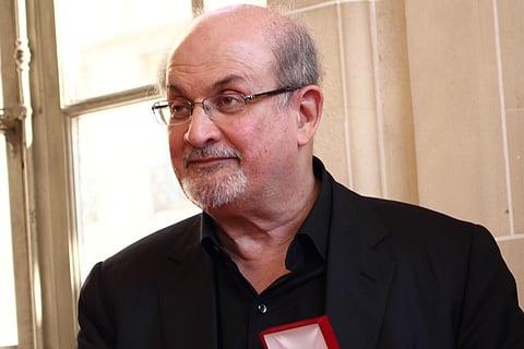 File image of author Salman Rushdie in a black blazer