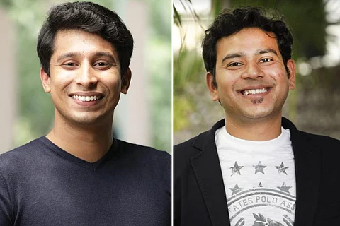 Picture of two men side-by-side smiling at the camera