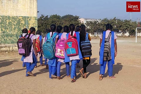 A group of school students wearing uniform and walking forward