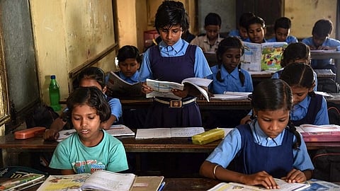 Children seated in a classroom
