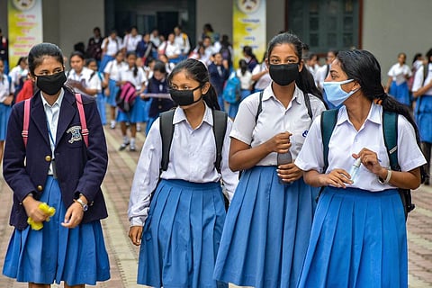 School students with masks and in uniform