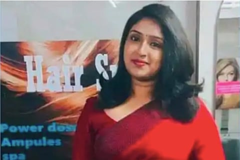 Woman in a red saree