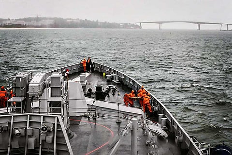 Representative image of sailors on a ship