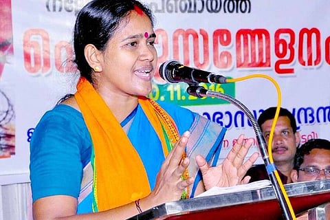BJP leader Shoba Surendran clad in a blue saree, talking at an event