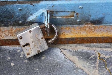 A lock put on a shutter of a shop