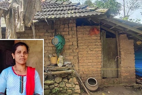 hamadathil Sindhu Babu with the photo of her house