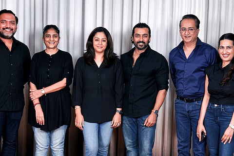 Actor Suriya, jyothika and Sudha Kongara posing with the Hindi producers