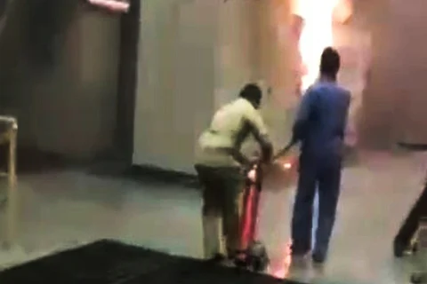 Staff trying to douse the fire