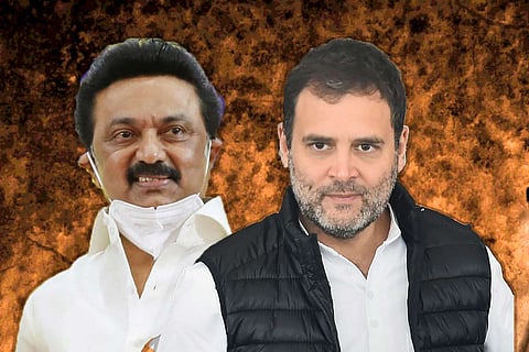A pic that shows MK Stalin in a white shirt wearing a mask and Rahul Gandhi wearing a white shirt and a black sleeveless jacket