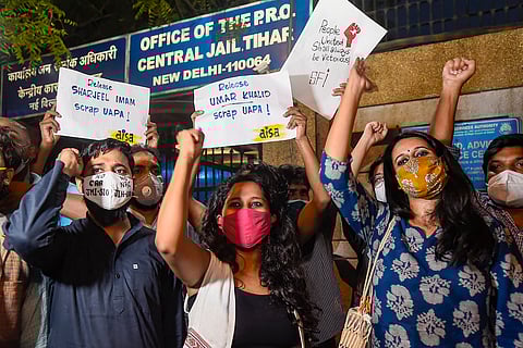Student activists Natasha Narwal, Devangana Kalita and Asif Iqbal Tanha outside Tihar prison