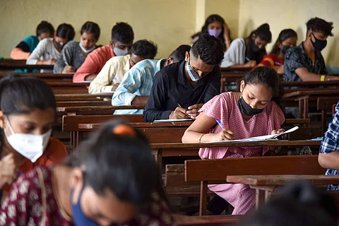 Representative image of students writing an exam