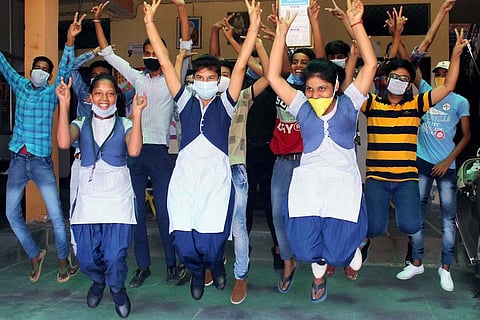 Students jumping with joy of victory