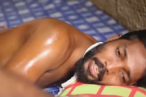 Man after being beaten by the police