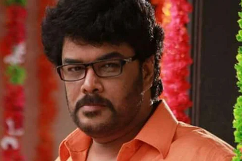Sundar C is seen wearing an orange shirt and spectacles in the photos.