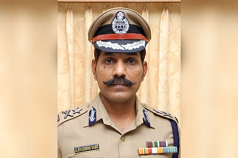 Sylendra Babu looking at the camera in his uniform