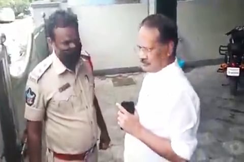 A TDP leader arguing with the police
