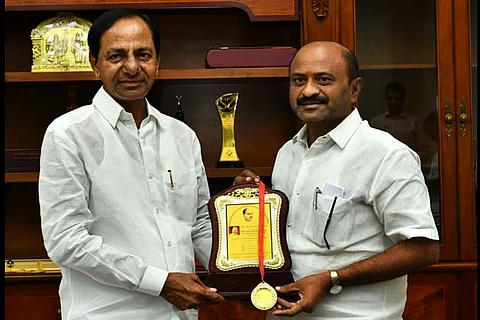 MLA Challa Dharma Reddy shares a moment with CM KCR