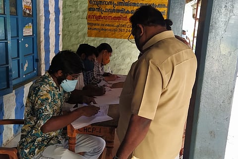 NGO Coastal Students Cultural Forum helping a man with vaccine registration