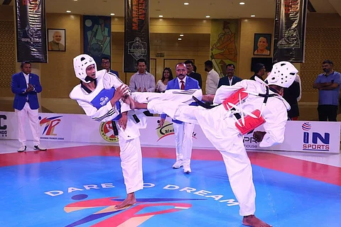 Taekwondo players in action