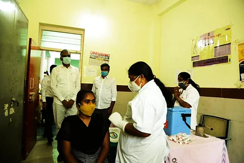 Telangana Health Minister interacts with a vaccinating teenager in Sangareddy