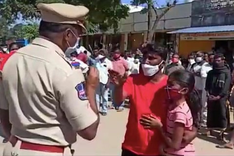 A Telangana man questioning a cop for allegedly slapping him in front of his daughter