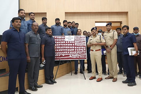 Police personnel pose with the drugs that were recovered in Hyderabad