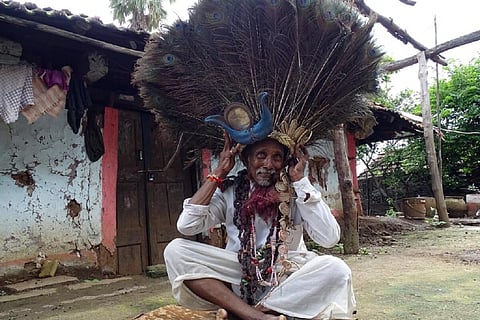 In better times, Kanaka Raju sporting the peacock feather hat worn by Ghusadi dancers